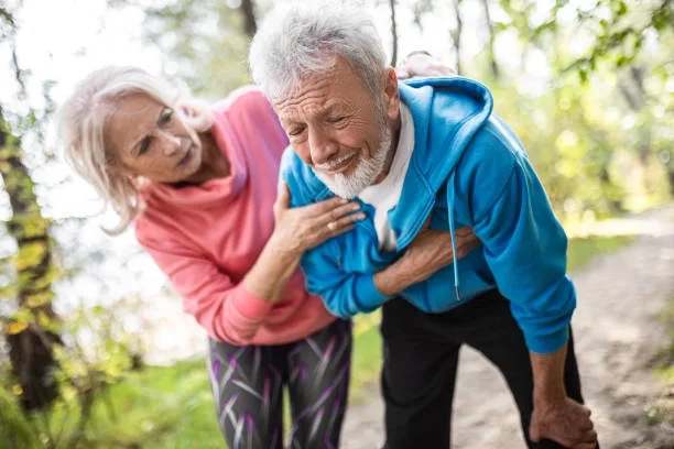 Senior man having heart problems during exercise